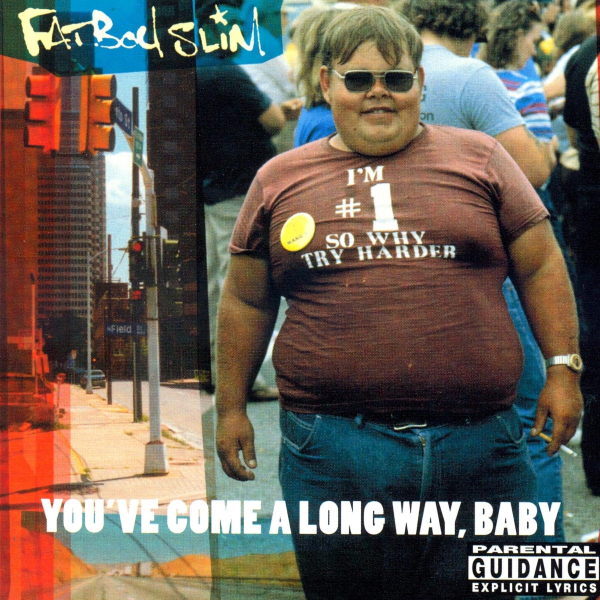 Candid outdoor photo of a smiling, heavyset young man in casual summer clothes, photographed at a 1983 festival and used unaltered as the album's front cover.