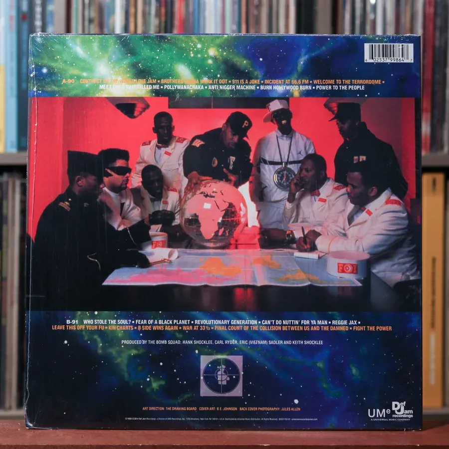 Back cover of Public Enemy's 1990 album Fear of a Black Planet, showing Chuck D, Flavor Flav and Terminator X gathered around a table in a dark war room surrounded by papers, equipment and album-related imagery